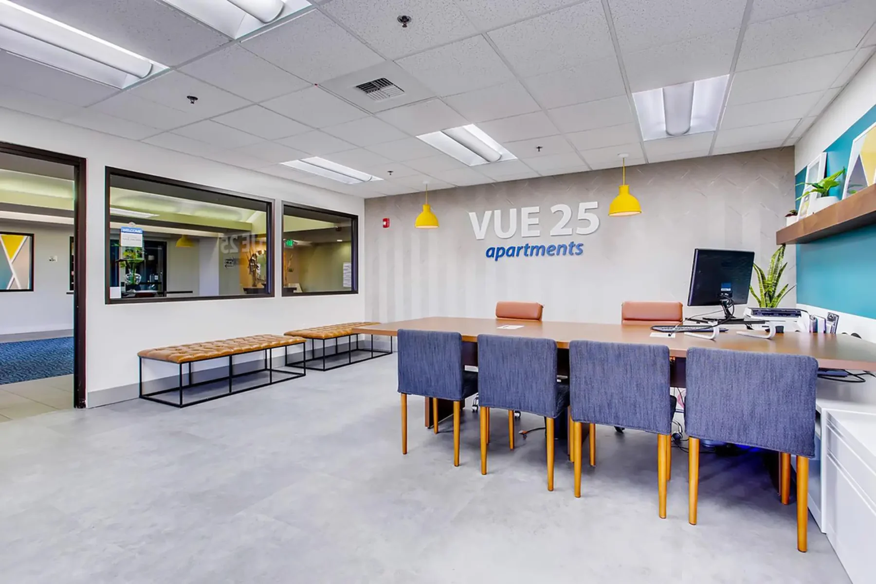 Leasing office with reception desk and waiting area at VUE25 apartments in Tacoma, WA