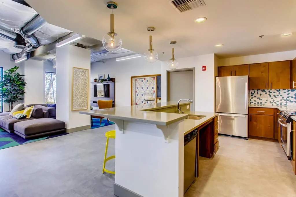 Clubhouse kitchen with bar seating and lounge