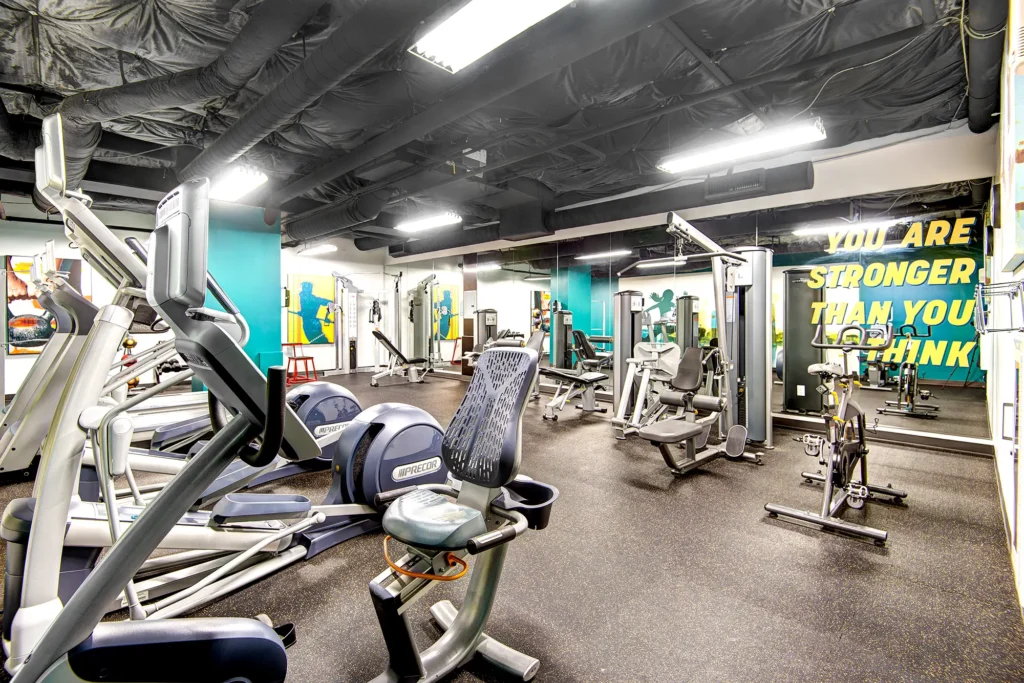 Fitness center with strength training machines and cardio equipment