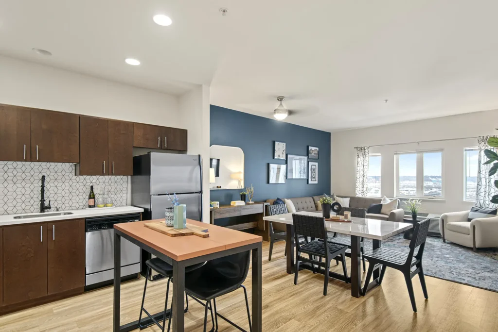 Kitchen looking over island into dining and living room