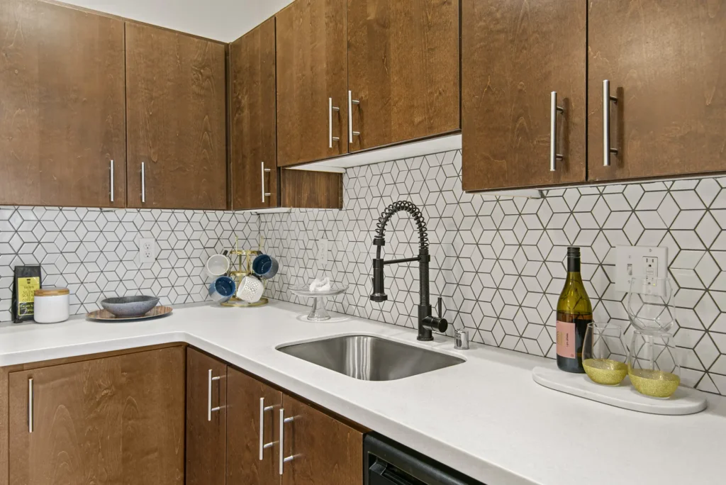 Kitchen with quartz counters and tile backsplash